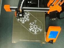video of snowflakes being printed on a 3D printer