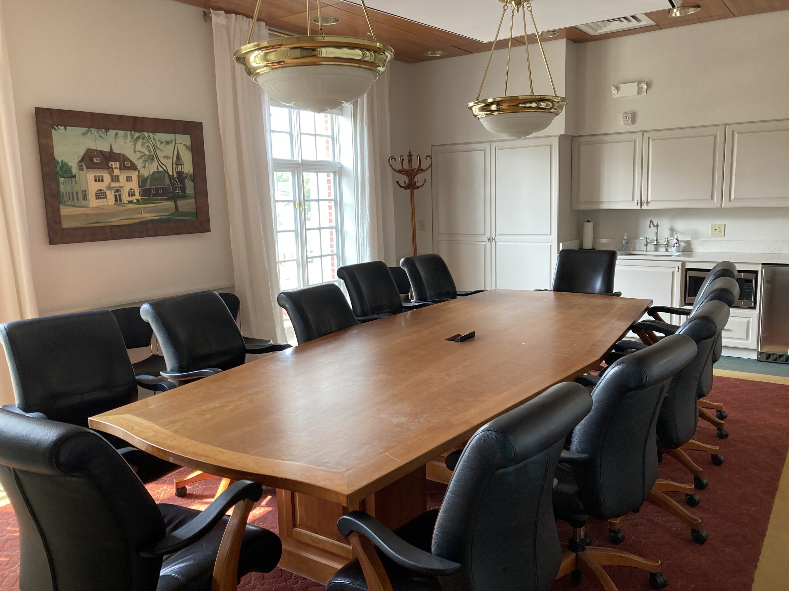 board room with conference table and kitchenette
