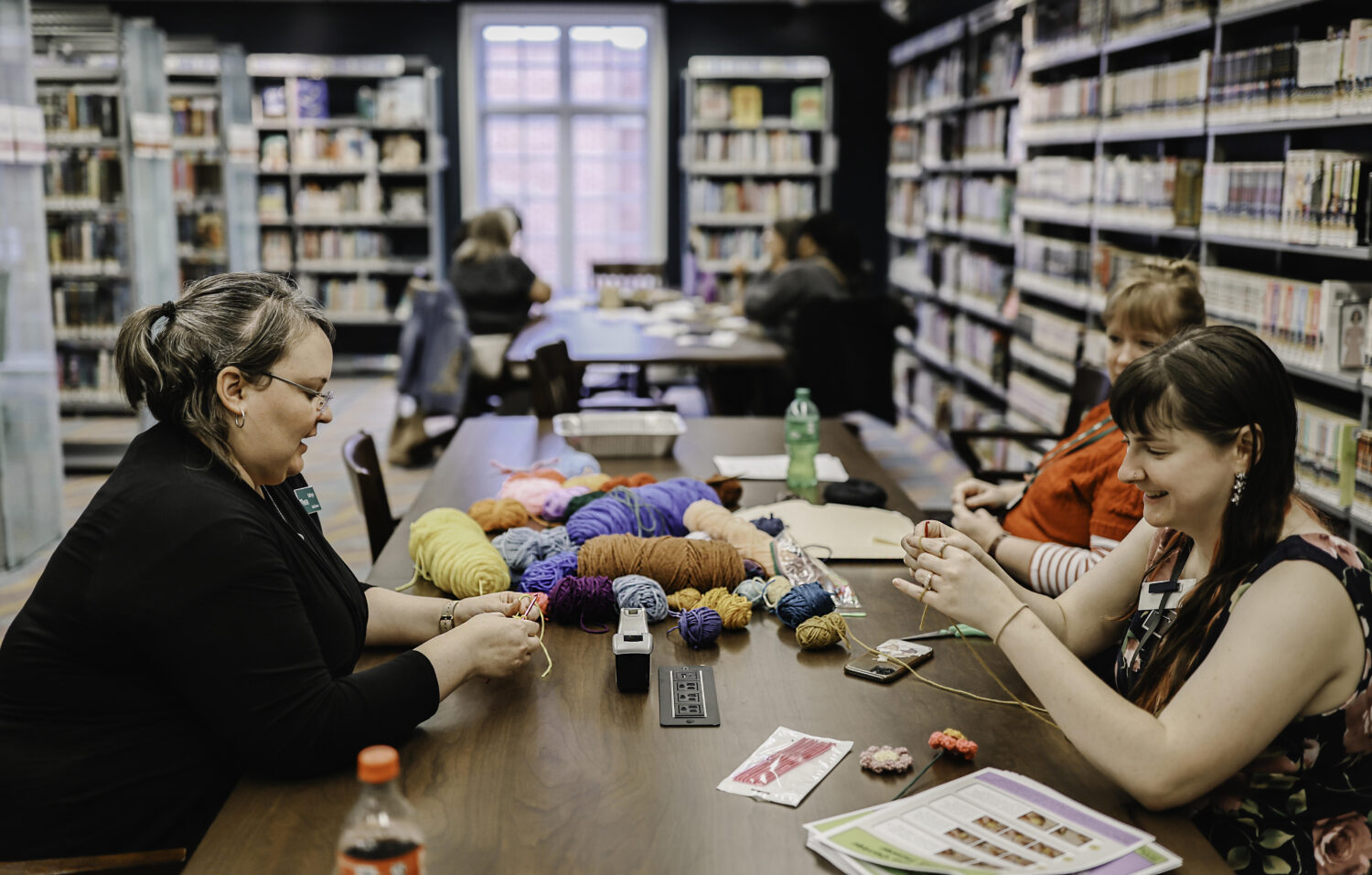 Patrons and library staff participate in a crafting event at the Plymouth District Library.