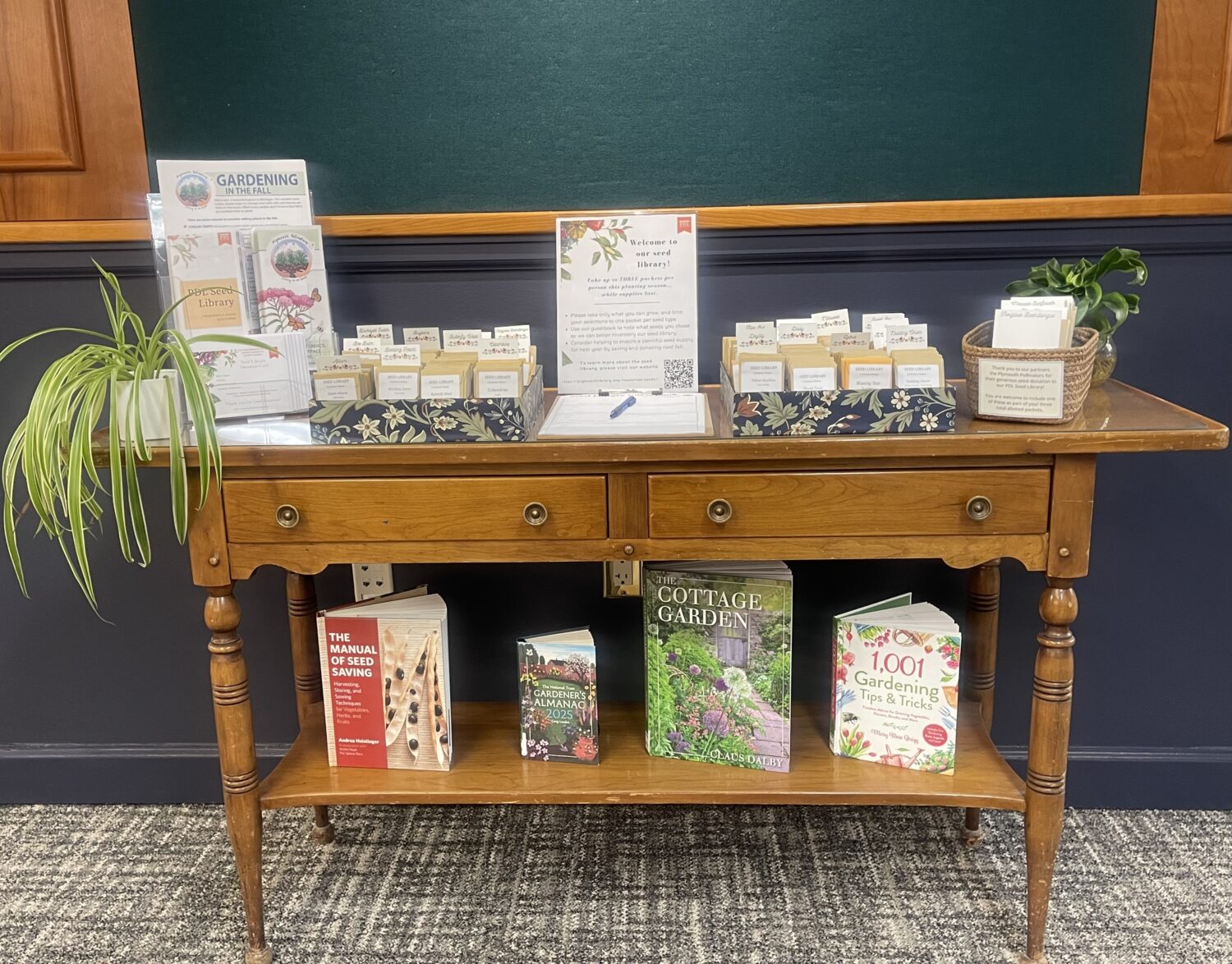 Seed library table with seeds and books