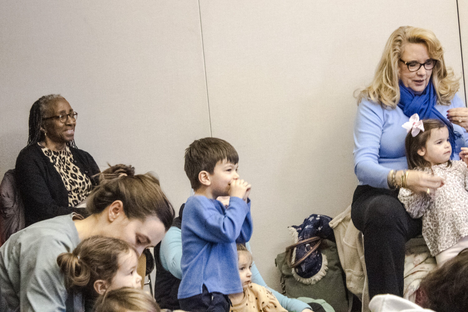 Volunteer Toni Jones and patrons enjoy Super-Sized Storytime on a Wednesday morning at the Plymouth District Library.