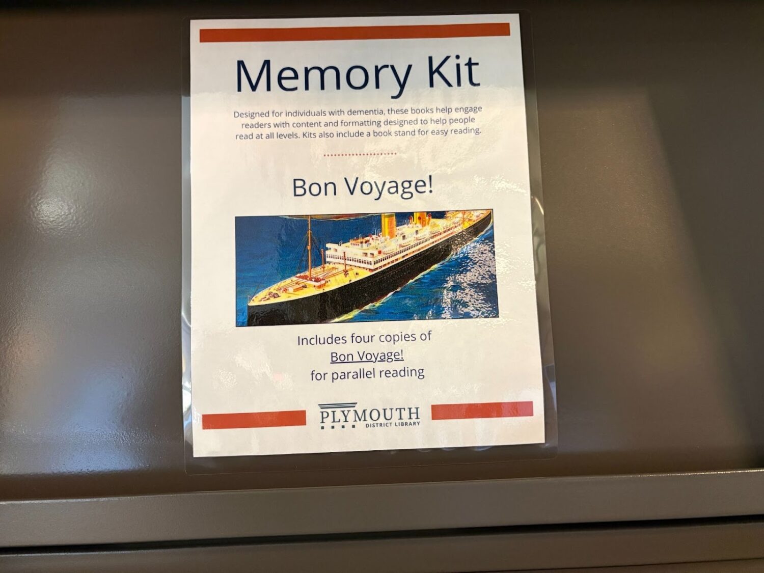 Close-up of a memory kit, with four copies of "Bon Voyage!", for parallel reading.
